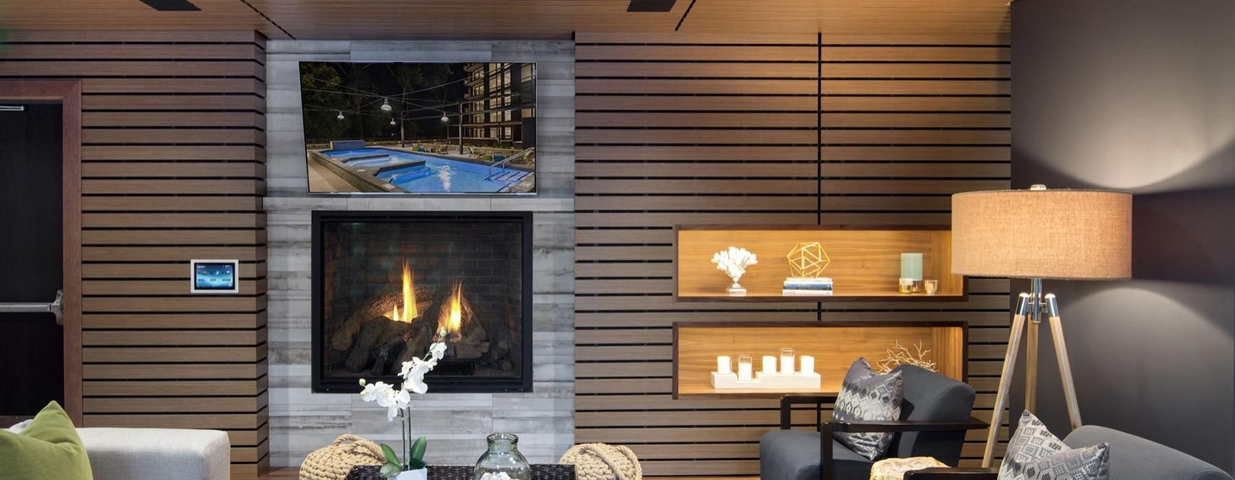 a living room with a fireplace and tv