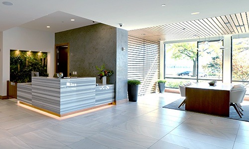 Access to resident-only features concierge with desk and large windows