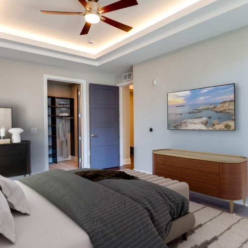 Generous bedroom offerings to fit every family a bedroom with a bed and a fan