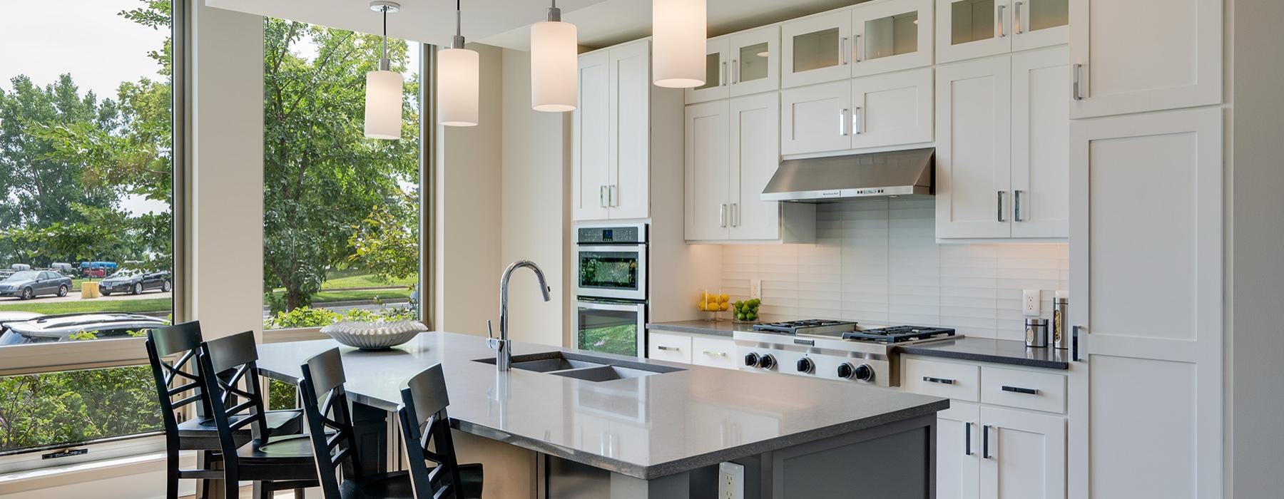 a kitchen with white cabinets
