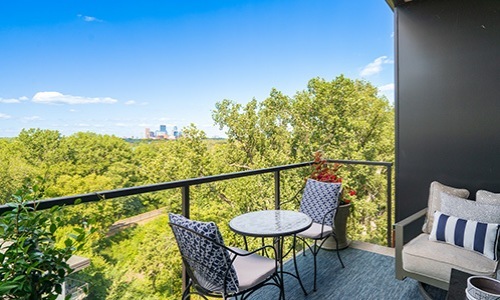 Spacious balconies balcony with seating and view of trees