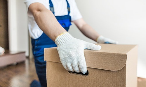 Take advantage of all The Lakes Residences has to offer a person with gloves holding a box