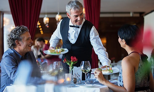 Welcome home people being served food at a restaurant