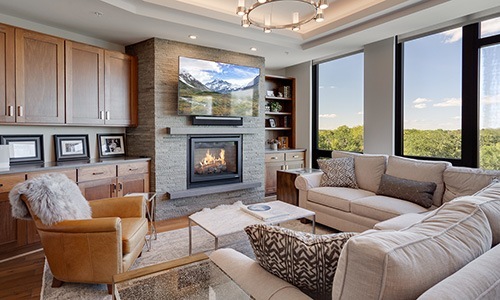 Spacious living areas living room with couch fireplace tv and windows