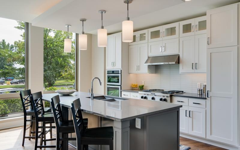 a kitchen with white cabinets